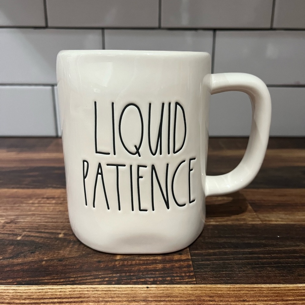 Rae Dunn White Ceramic Coffee Cup with Liquid Patience Text and Yellow Accents